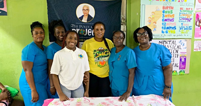 Kessandra James (forefront) shares a light moment with health aid workers at the Old Harbour Health Centre.