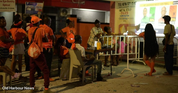 Supporters of Dr Kurt Waul look on in disbelief at his constituency HQ in Old Harbour.. (OH News Photo)