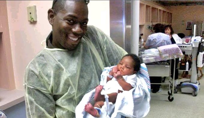 Renaldo Chambers with son Cristiano after his wife Annmarie gave birth.