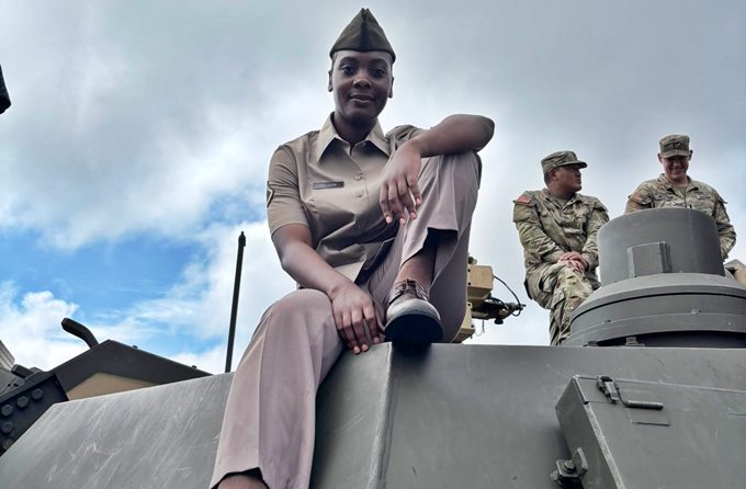 Nelson atop a US Army tanker