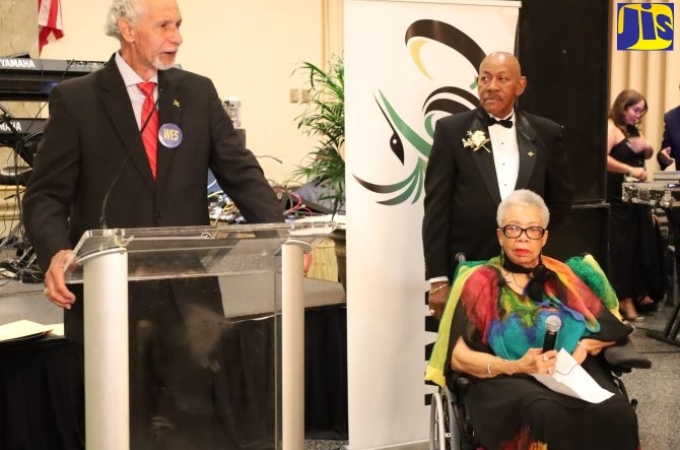 Former Maryland State Senator, Shirley Nathan Pulliam (seated in the wheelchair), listens as Ambassador Curtis Ward (at lectern) pays tribute to her, during the Jamaica Association of Maryland’s Independence gala held on Saturday (August 13) in Baltimore in the United States (US). (Photo: Derrick Scott)