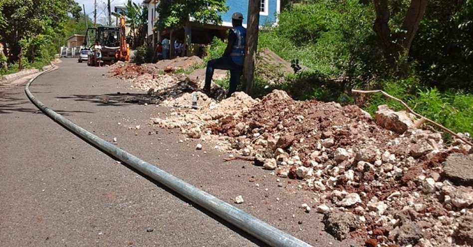 Approximately 3000 feet of four-inch galvanized being laid in the community of Brethren Town. (OH News Photo)
