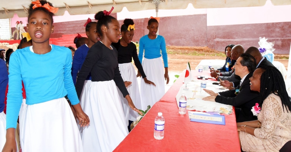 Students perform a cultural item at the official opening of the new Campbell’s Castle Primary School building in Manchester, which was constructed at a cost of $51 million. Seated (from left) are Director of Donor and Partnership Management, National Education Trust (NET), Latoya Harris; Member of Parliament for South Manchester, Michael Stewart; Advisor at the Ministry of Education, Youth and Information, Howard Chamberlain; Japan's Ambassador to Jamaica, His Excellency Hiromasa Yamazaki; and Principal of the school, Petagaye Campbell.
