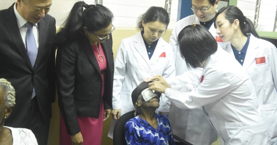 Chinese doctors from the Bright Journey Medical Mission examine a patient at the Kingston Public Hospital in Kingston, Jamaica.