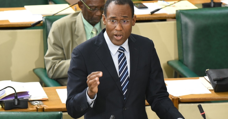 Minister of Finance and the Public Service, Dr. the Hon. Nigel Clarke, emphasises a point while closing the 2020/21 Budget Debate in the House of Representatives on March 24. In the background is Minister without portfolio for Industry, Commerce, Agriculture and Fisheries, Hon. J.C. Hutchinson. (JIS Photo)