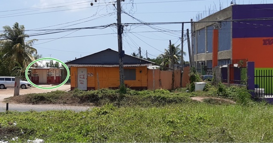 Eaton 'Tuffy' Whyte operated this shop (encircled) at the entrance of this dirt lane in Marlie Mount, Old Harbour (OH News Photo)