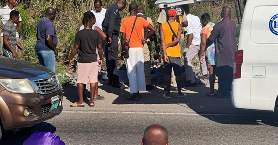 Scores of persons gathered at the spot where the body of Hakeem James was found. (OH News Photo)