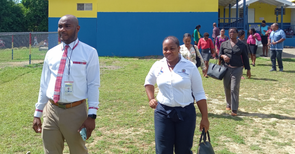 Jason Bryan (left), principal, Davis Primary and Sophia Forbes-Hall, Ministry of Education, Regional Director, Region 6