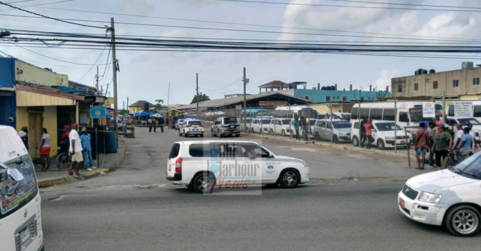Police cordon off the crime scene on Market Street, Old Harbour. (OH News Photo)