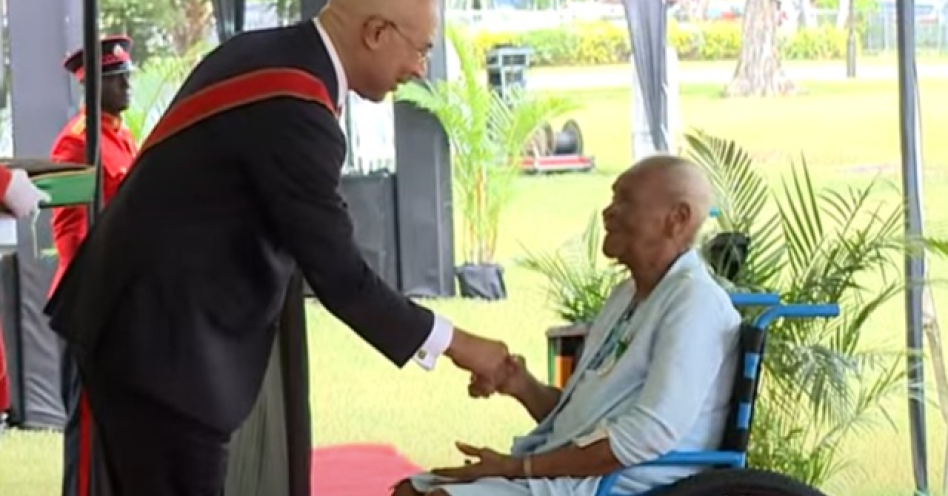 Centenarian Nellie Pennycooke (right) collects her national award from Governor General Sir Patrick Allen on Heroes Day, October 16, 2023. (Contributed Photo)