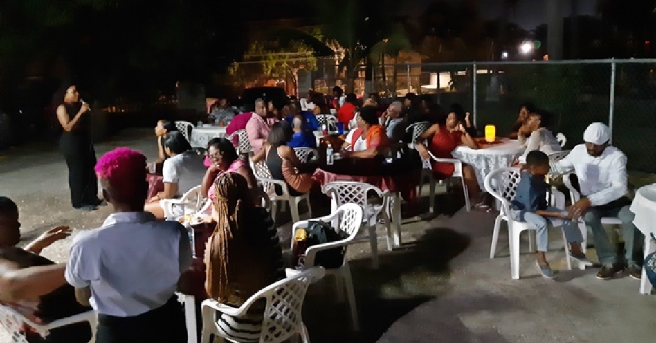 Treacha Reid-McCalla (left) speaking at a dinner she organised for the Yadel Home for Girls at Shades of Elegance on South Street, Old Harbour. (OH News Photo)