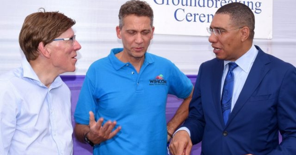 Prime Minister, the Most Hon. Andrew Holness (right) speaking with Director, Silver Sun Estate, Paul Raboud (left) and Chairman, West Indies Home Contractors Limited (WIHCON), Peter Melhado, during the groundbreaking ceremony for the new Silver Sun Estate housing development in Innswood. St. Catherine on Wednesday