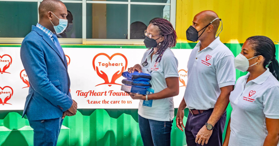 TagHeart Foundation members Dr Odette Thomas (centre), Mark McTaggart (2nd right), Thornia Smith (right), present medical items to Calvin Harris, principal, Marlie Mount Primary and Infant School.