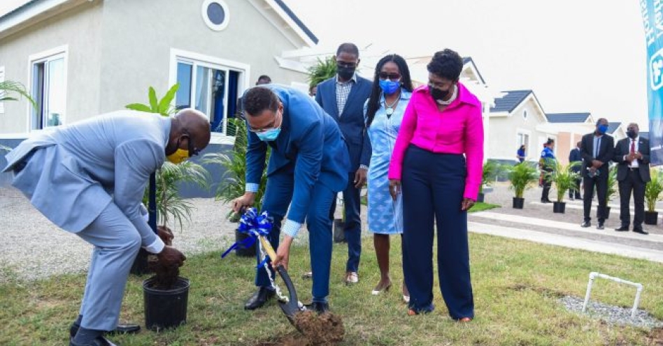 Prime Minister, the Most Hon. Andrew Holness (second left), and Minister of Housing, Urban Renewal and Climate Change, Hon. Pearnel Charles Jr., plant trees at the newly opened Twickenham Glades housing development in St. Catherine, during a handover ceremony on Wednesday (December 1). Looking on are Twickenham Glades homeowner Dwight Bailey (centre); Board member of the National Housing Trust (NHT), which undertook the development, Nesta-Claire Hunter (second right), who represented Board Chairman, Lennox Channer; and Member of Parliament for St. Catherine Eastern, where the development is located, Denise Daley.