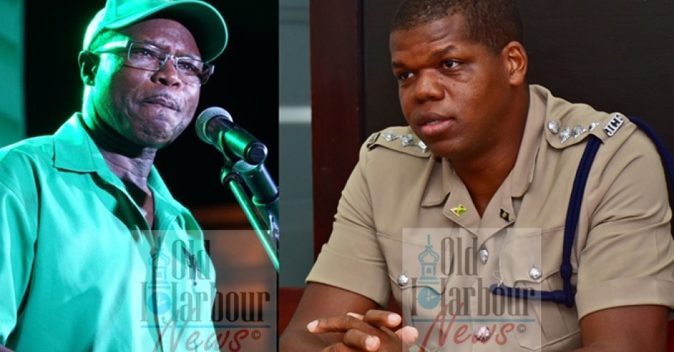 Everald Warmington (left) and DSP Damion Manderson, commander in charge of the Old Harbour sub-division. (OH News Photo)