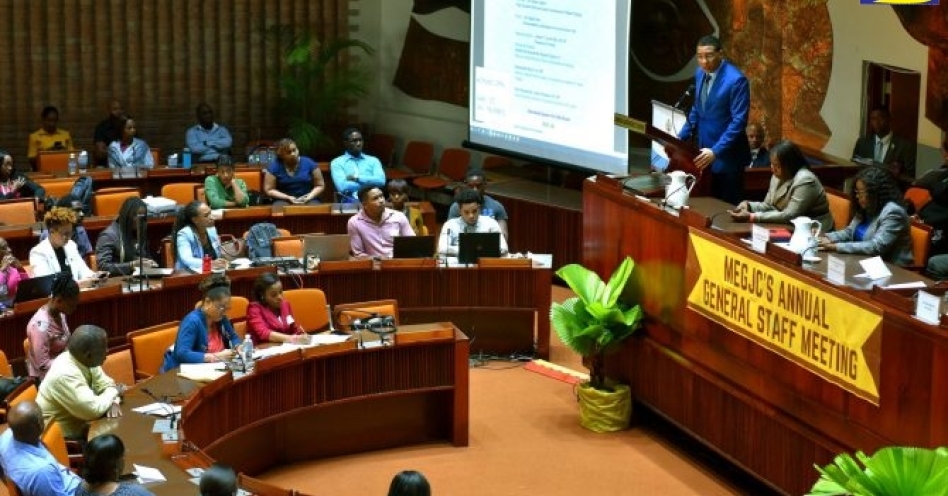 Prime Minister, the Most Hon. Andrew Holness (standing right) addressing the Ministry of Economic Growth and Job Creation's general staff meeting on Thursday (January 23), at the Jamaica Conference Centre, downtown Kingston. (JIS Photo)