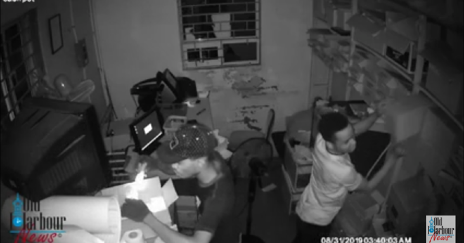 A screen grab of crooks breaking into the cash pot office at Rubis Service Station, Old Harbour.